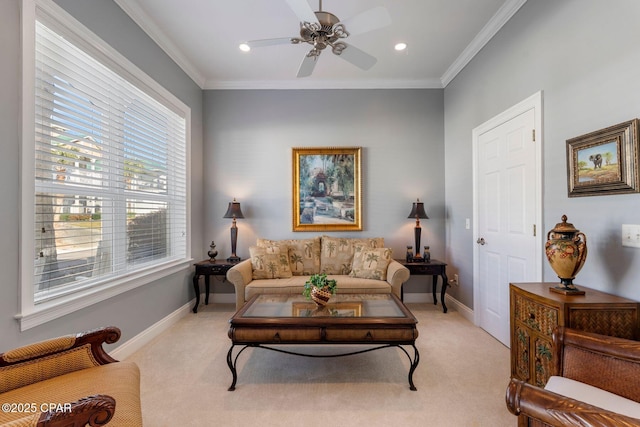 living room with crown molding, light colored carpet, and ceiling fan