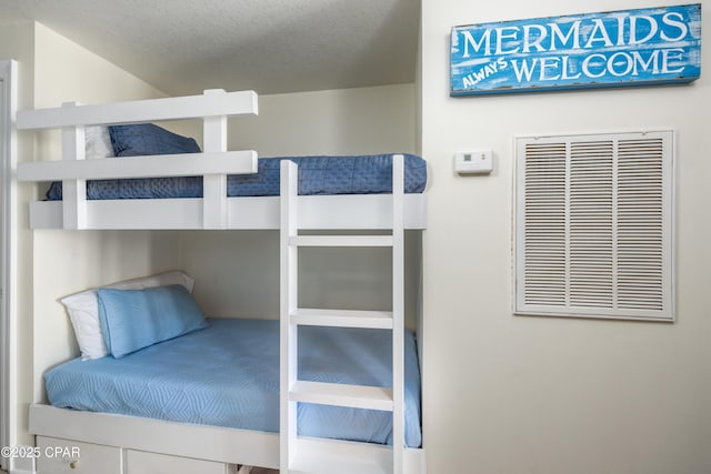 unfurnished bedroom featuring a textured ceiling