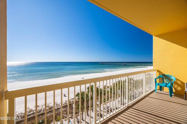 balcony with a beach view and a water view