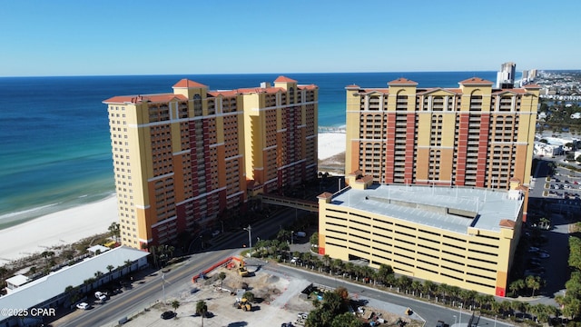 birds eye view of property featuring a water view and a view of the beach