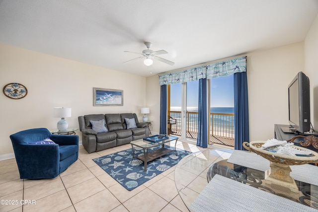 tiled living room featuring ceiling fan