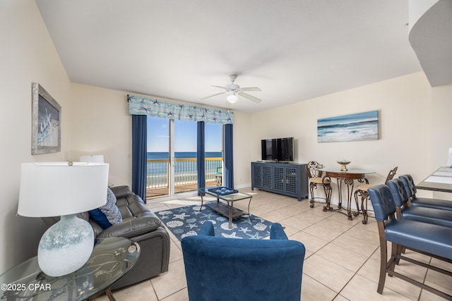 tiled living room featuring ceiling fan