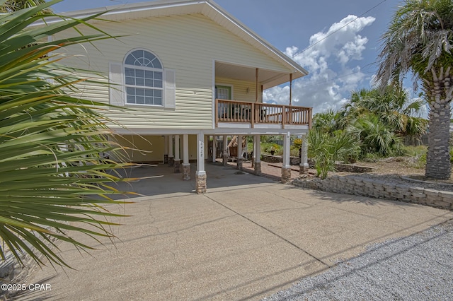 exterior space with a carport