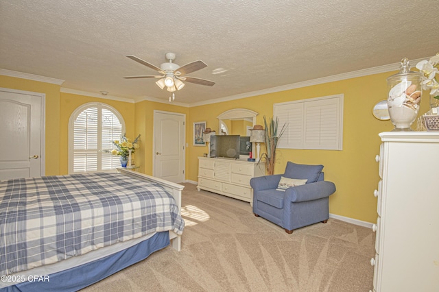 bedroom featuring light carpet, a textured ceiling, ornamental molding, and ceiling fan