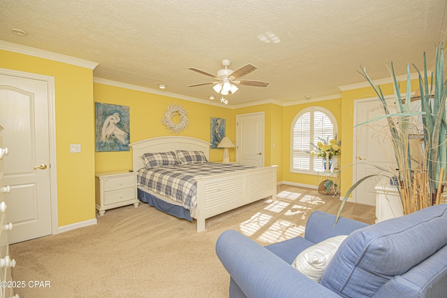 bedroom with crown molding, a textured ceiling, ceiling fan, and carpet