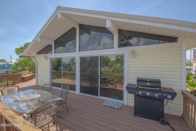 wooden deck with a grill