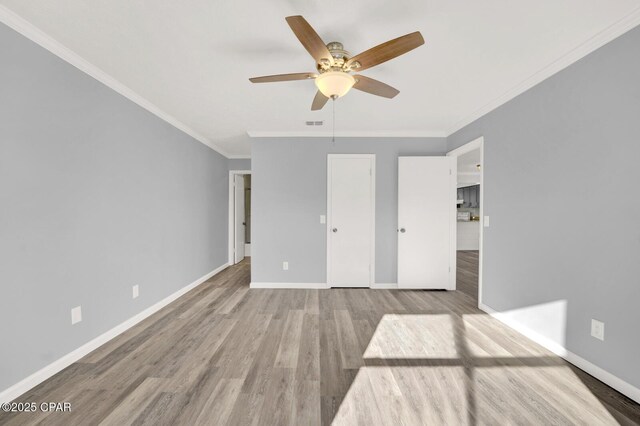 unfurnished living room featuring plenty of natural light, ceiling fan, and light hardwood / wood-style flooring