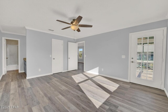 unfurnished bedroom with crown molding, light wood-type flooring, and ceiling fan