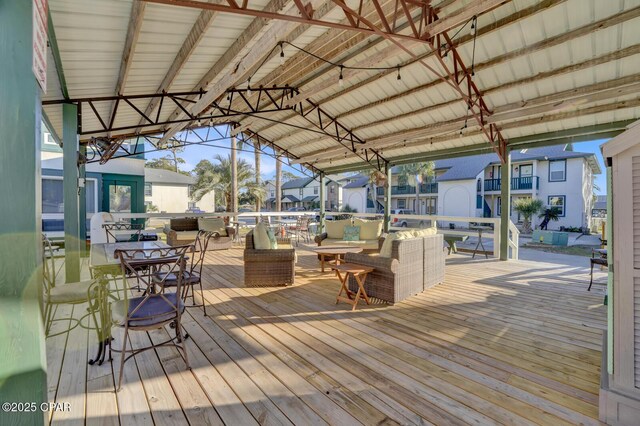 unfurnished sunroom with ceiling fan