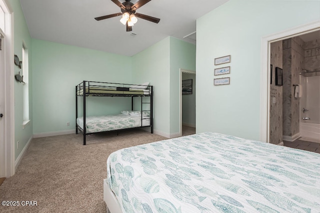 carpeted bedroom with a ceiling fan and baseboards