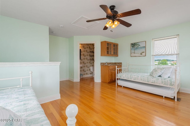 bedroom with baseboards, light wood-type flooring, and ceiling fan