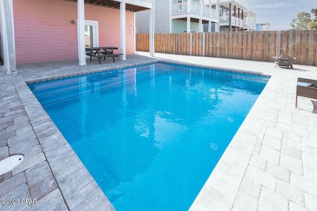 view of pool featuring a fenced in pool, a patio area, and fence