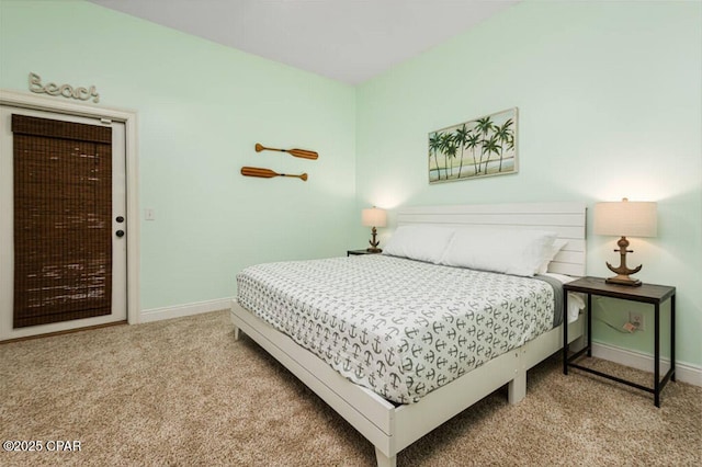 bedroom featuring carpet and baseboards