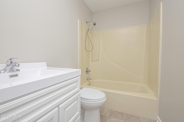 full bathroom featuring vanity, toilet, bathing tub / shower combination, and a textured ceiling