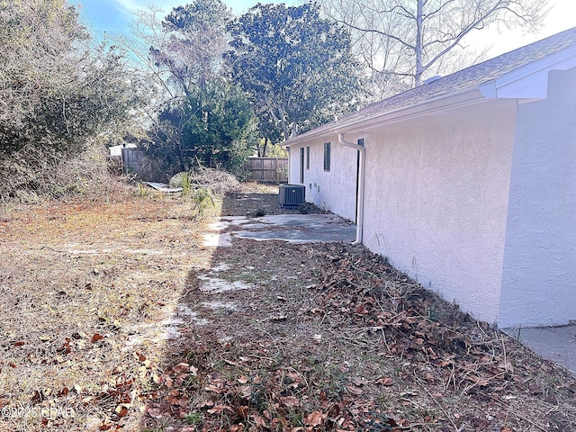 view of side of property with central AC