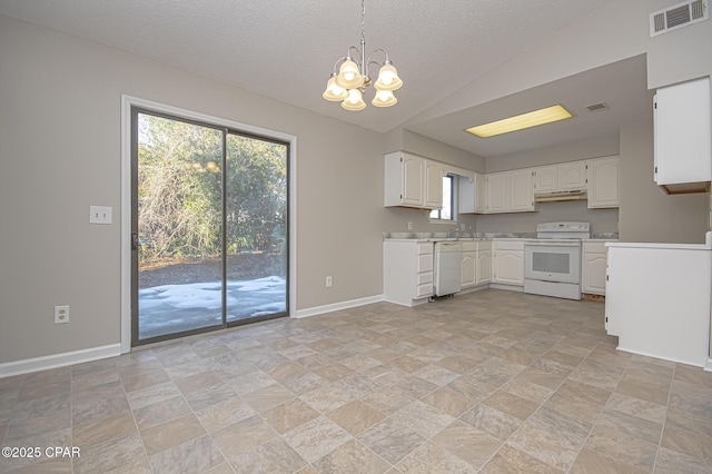 kitchen featuring plenty of natural light, white cabinets, and white appliances