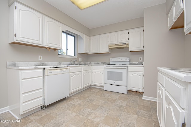 kitchen with white cabinetry, sink, and white appliances