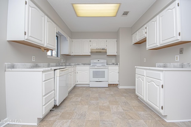 kitchen with white cabinetry and white appliances