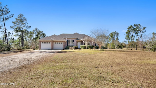 view of front facade with a garage and a front lawn