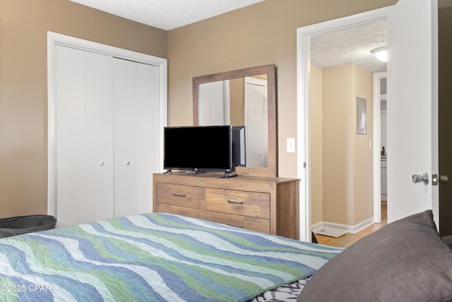 bedroom with a closet and a textured ceiling