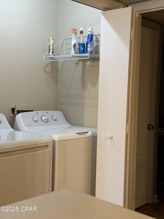 washroom with washer and clothes dryer