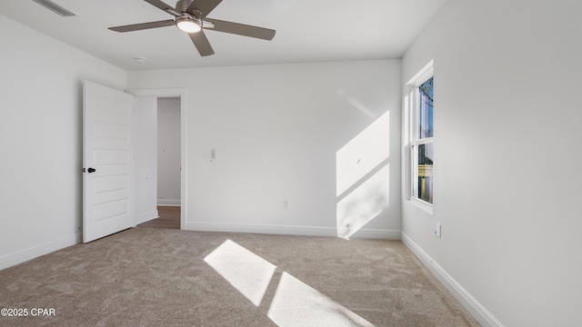 carpeted empty room with ceiling fan