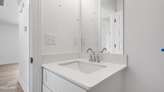 bathroom featuring vanity and wood-type flooring