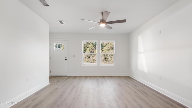 spare room featuring light hardwood / wood-style floors and ceiling fan