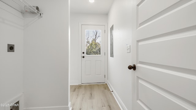 laundry room featuring hookup for an electric dryer and light wood-type flooring