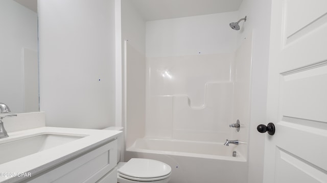 full bathroom featuring vanity, bathing tub / shower combination, and toilet