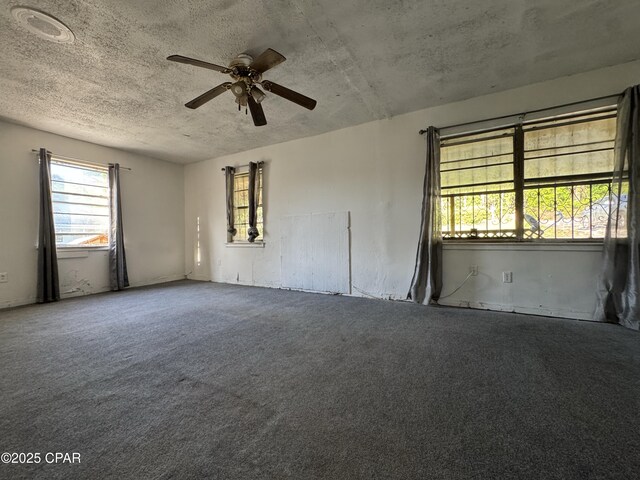 3109 Union Hill Rd, Marianna, FL 32446 - full bathroom with wainscoting, tile walls, a textured ceiling, and toilet