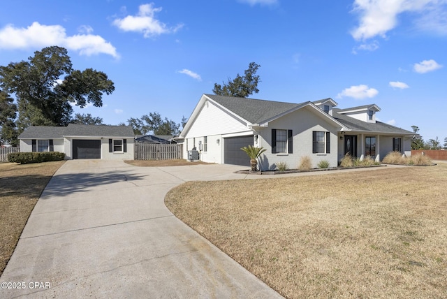 view of front of home featuring a garage and a front lawn