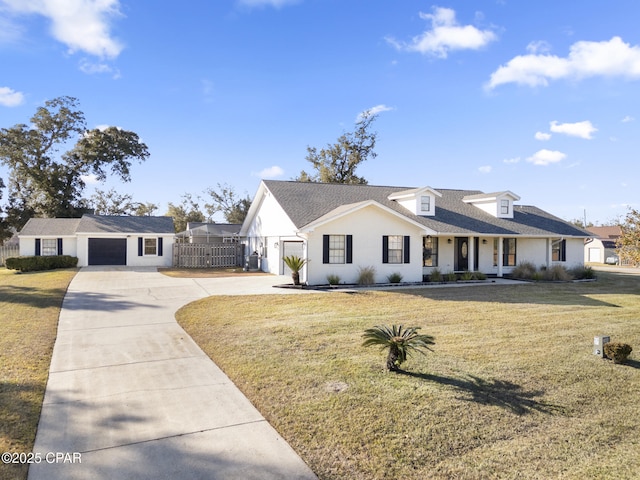 view of front of house featuring a garage and a front yard