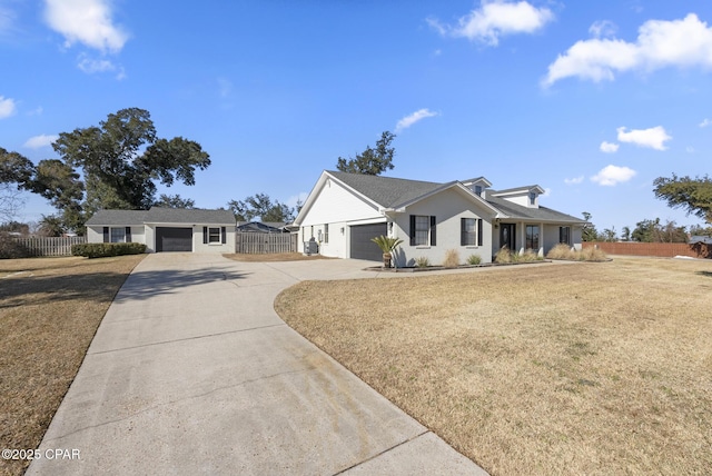 view of front of home featuring a garage and a front yard