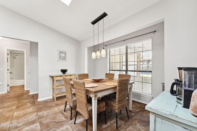 dining area with vaulted ceiling