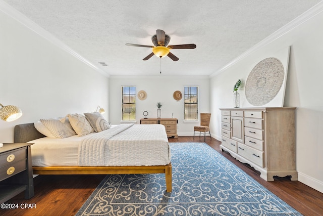 bedroom featuring ceiling fan, dark wood-type flooring, ornamental molding, and a textured ceiling