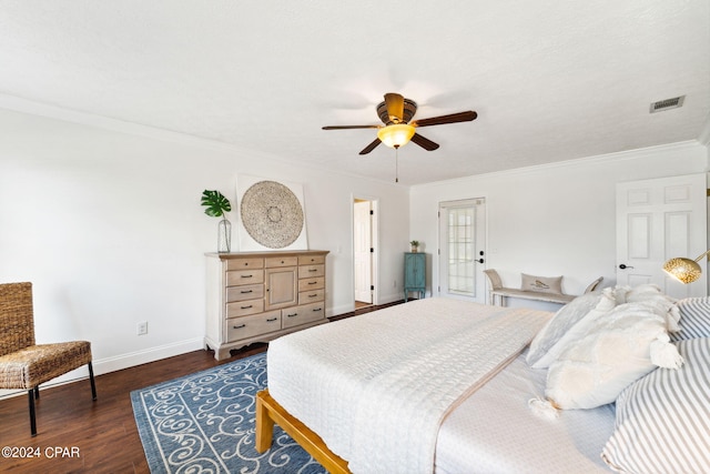 bedroom featuring ceiling fan, ornamental molding, and dark hardwood / wood-style flooring