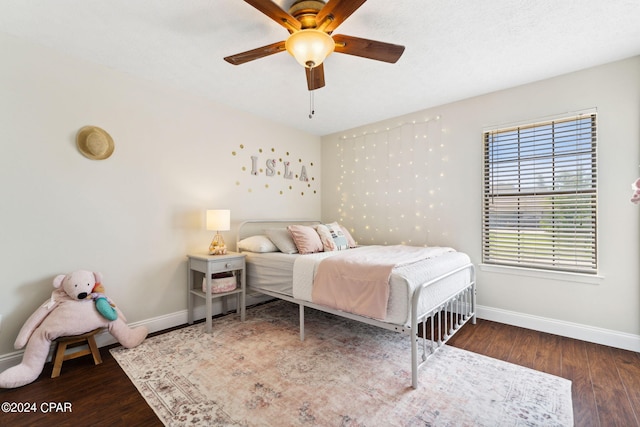 bedroom featuring dark wood-type flooring and ceiling fan