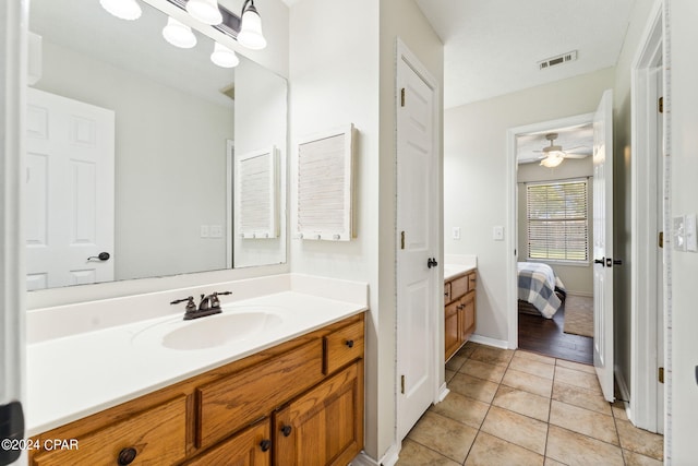 bathroom with vanity and tile patterned flooring