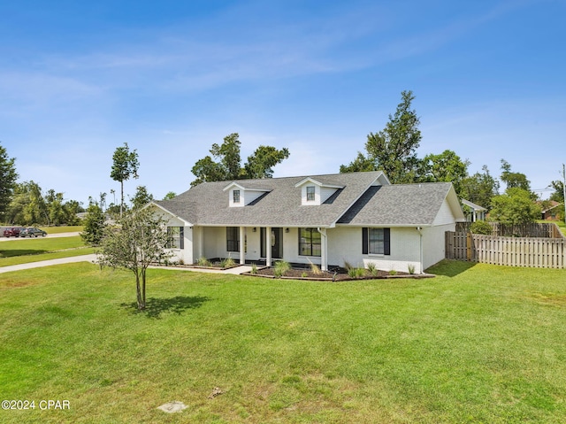 view of front of home with covered porch and a front lawn