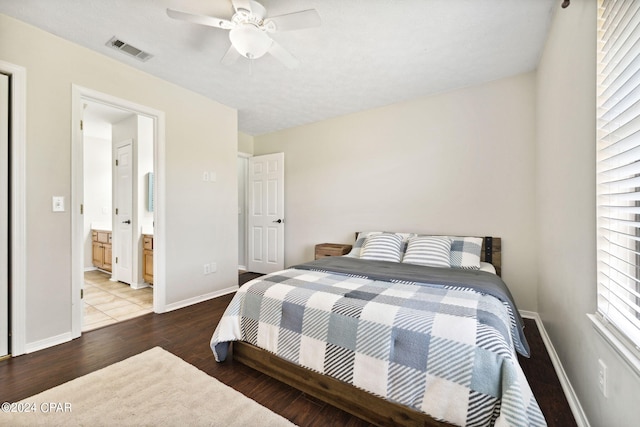 bedroom featuring ceiling fan, wood-type flooring, and connected bathroom