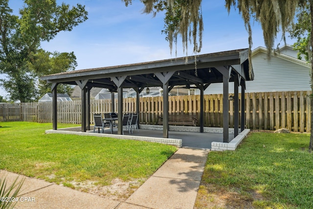 view of property's community with a gazebo and a yard