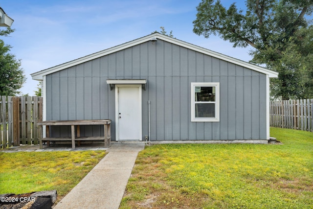 view of outdoor structure with a lawn