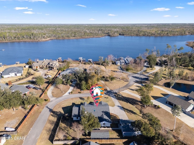 drone / aerial view with a water view