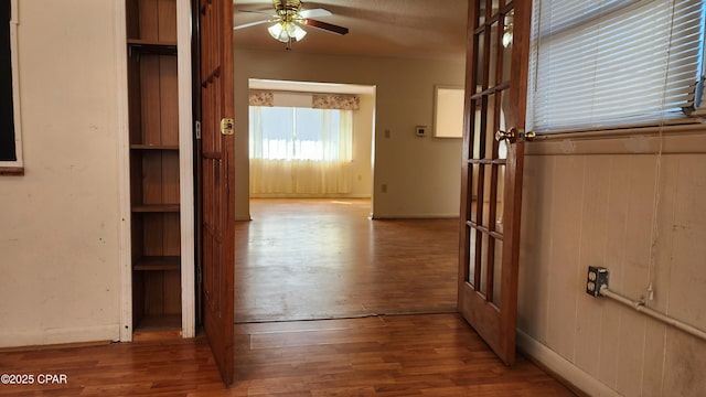 hall with wood-type flooring