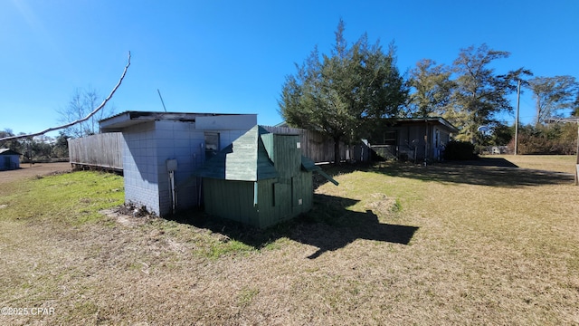 view of property exterior with a yard