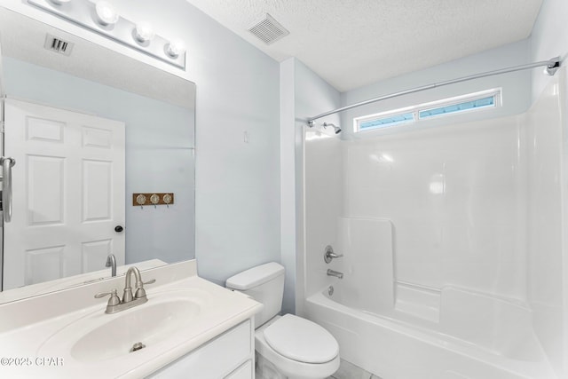 full bathroom with toilet, vanity, bathtub / shower combination, and a textured ceiling