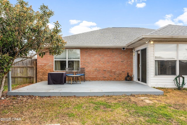 back of house featuring a wooden deck and a yard