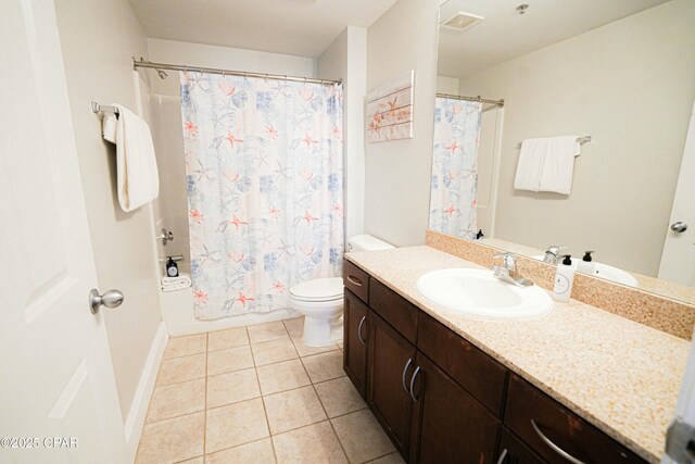 full bathroom with shower / bath combination with curtain, vanity, tile patterned floors, and toilet