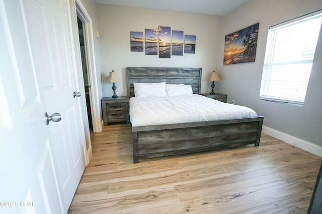 bedroom with light hardwood / wood-style flooring